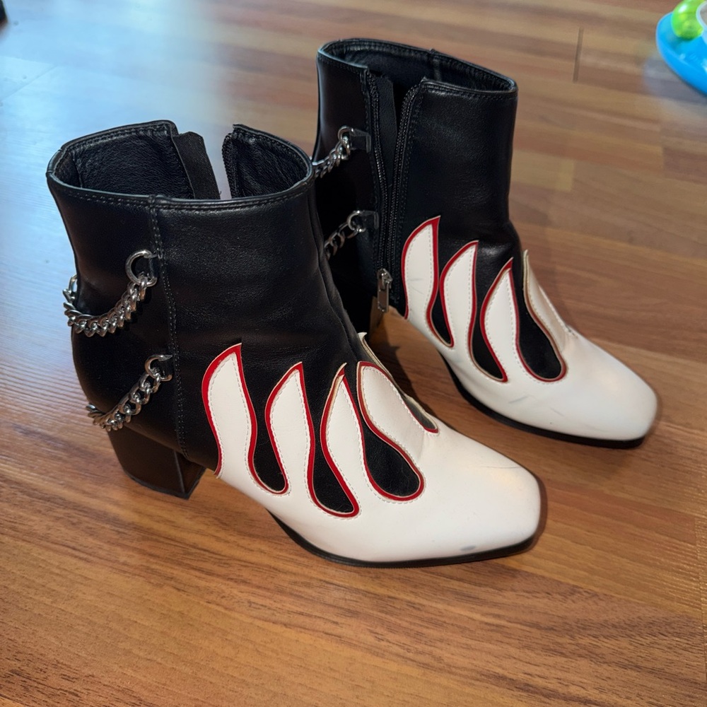 Black leather ankle boots with red accents, featuring a 3" heel and 1" platform